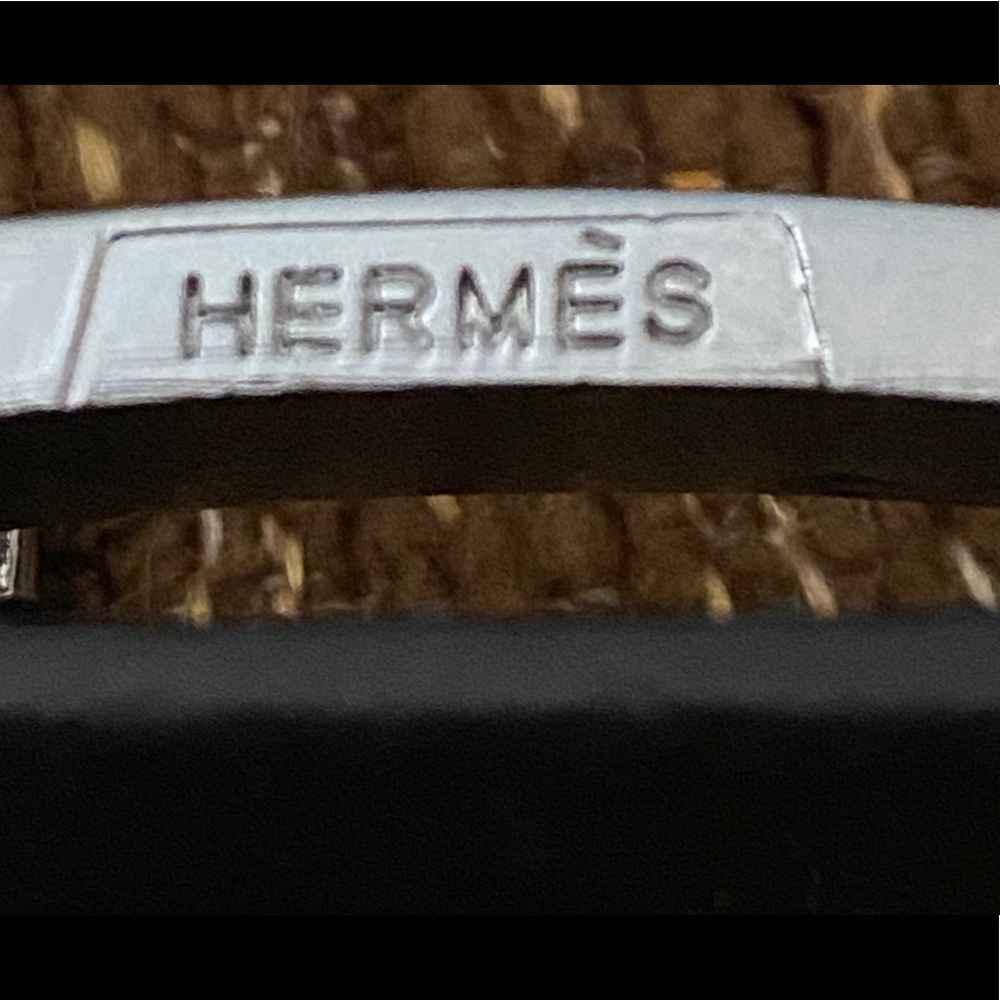 Hermès black “Constance” belt.